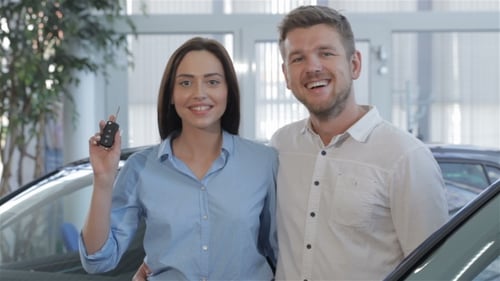 Woman Shows Car Key at the Dealership