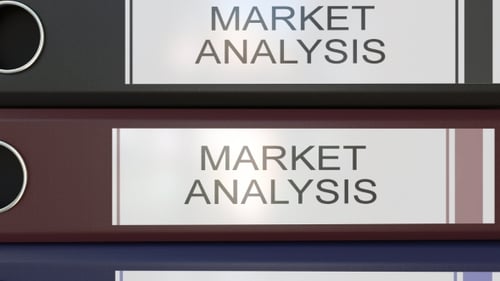 Vertical Stack of Multicolor Office Binders with Market Analysis Tags Different Years
