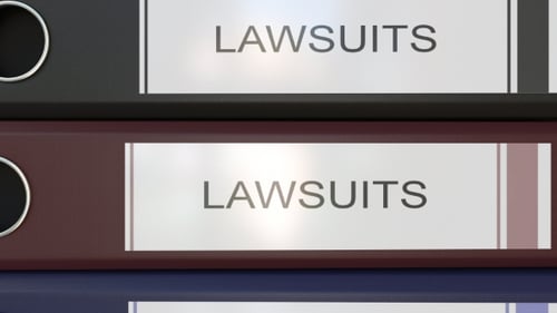 Vertical Stack of Multicolor Office Binders with Law Suits Tags