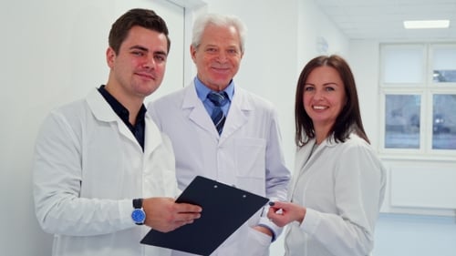 Medical Team Discussing Patient File in Hospital