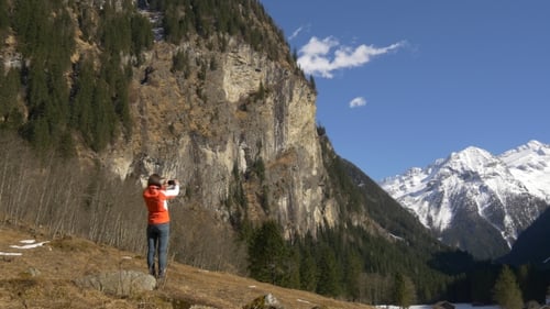 Woman Photographing High Rock