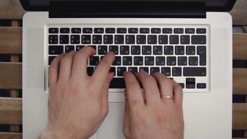 Businessman Hands Typing on Laptop Computer