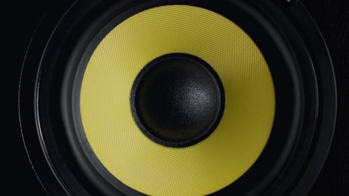 at Moving Sub-woofer. Speaker Part. Black and Yellow Colors.