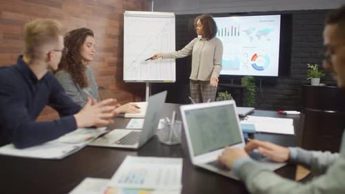 Colleagues Discussing Project At Coworking Loft