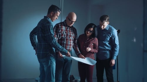 Team Discusses Plans in an Office Space