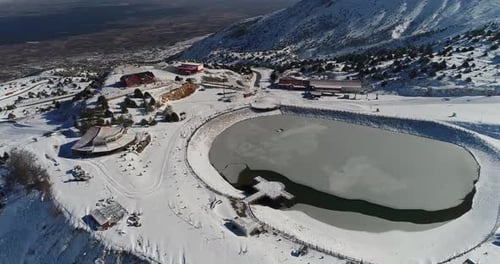 snowy mountains and icy lake