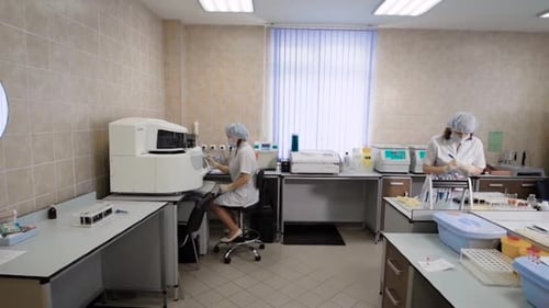 Scientists Working in a Modern Medical Laboratory