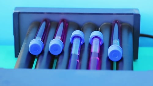 Test Tubes Rocking in a Lab