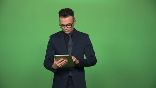 Confident Male Using Tablet