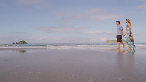 Couple walking on beach, Costa Rica. Shot on RED EPIC for high quality 4K, UHD, Ultra HD resolution.