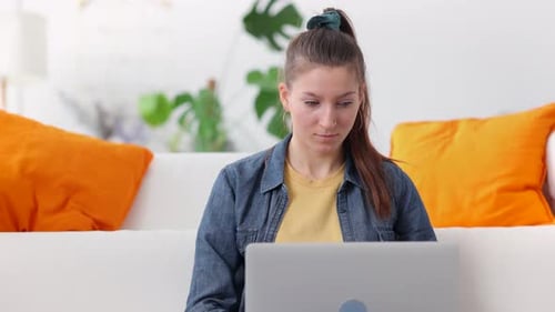Businesswoman Working or Using Laptop for Self Study While Sitting in Home Office Spbi