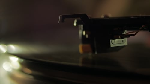 Record Player Needle on Vinyl Close Up in Dark