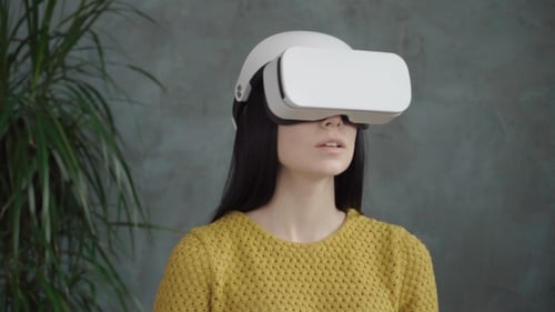 Woman Using Virtual Reality Headset in Home