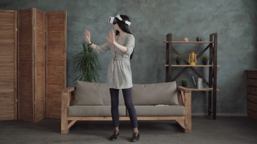 Woman Experiencing Virtual Reality in Home Interior