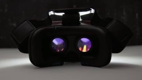 Futuristic Black Virtual Reality Headset in the Dark