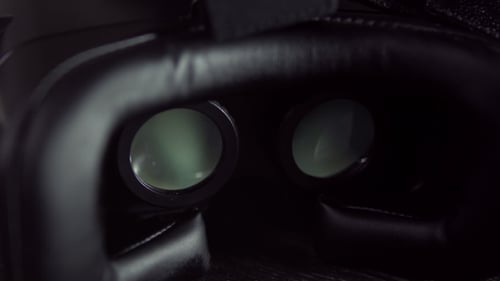 Close Up of VR Headset on Wooden Surface
