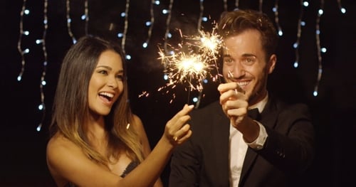 Couple Celebrates with Sparklers at Night