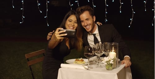 Couple Taking Selfie at Romantic Dinner Celebration