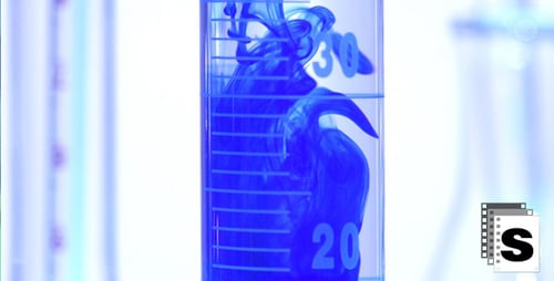 Blue Liquid Poured in Graduated Cylinder