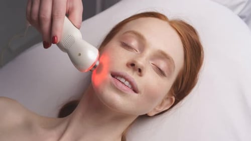 Happy Woman Receives a Hardware Phonophoresis Procedure From a Cosmetologist in a Spa Salon