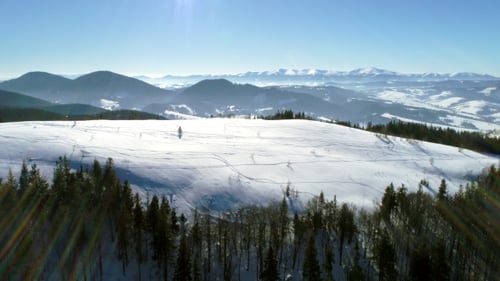 Aerial - Ski Lift at Ski Resort in Sunny Carpatian Mountains