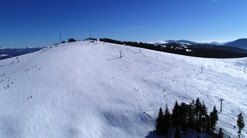 Aerial - Ski Lift at Ski Resort in Sunny Carpatian Mountains