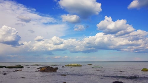 White Fluffy Clouds over the Sea