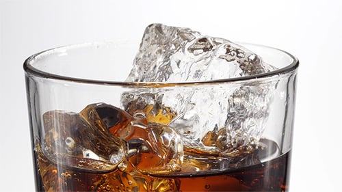 Refreshing Soda with Ice in Clear Glass Close Up