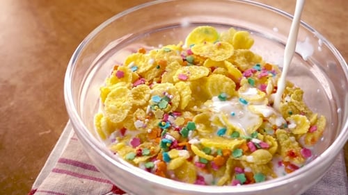 Milk Poured into Cereal with Sprinkles in Bowl