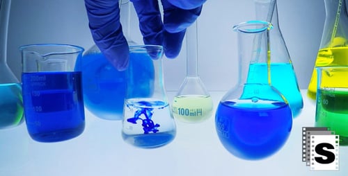 Laboratory Glassware and Liquid Being Added To Flask