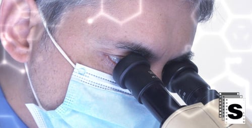 Scientist Looking into Microscope