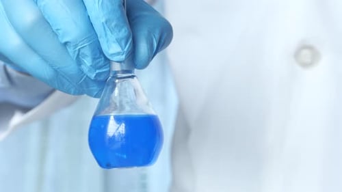Close Up of Scientific Experiment with Blue Liquid