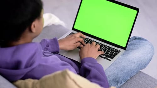 Black Woman Using Laptop Notebook Viewing Green Screen Press Keyboard Browsing Chroma Key