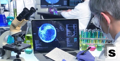 Scientist Working in Lab with Laptop and Microscope