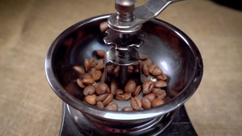 Coffee Beans Fall in the Old Grinder