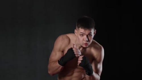 Young Shirtless Man Boxer Showing His Moves