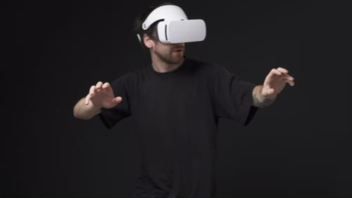 Man Playing VR Game with Virtual Reality Headset