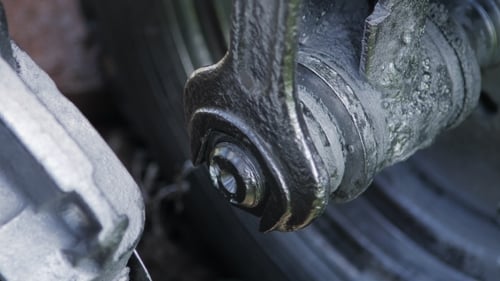 Mechanic Tightening the Screws