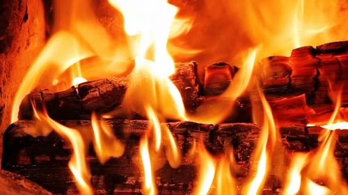 Close-up of Fireplace with Burning Logs
