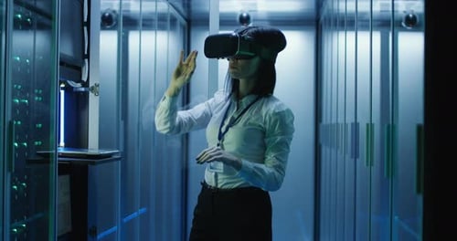 Woman in VR Glasses Working in Data Center