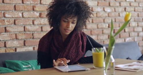 African Girl Using Table in Cafe
