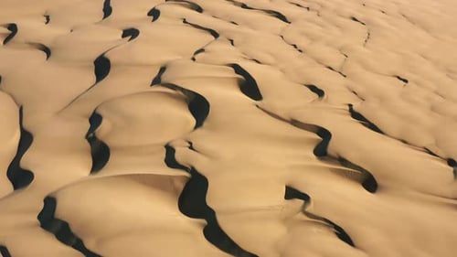 Aerial Drone Shot of the Desert Nature. Breathtaking Endless Waves of Dunes