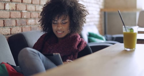 Adorable Woman Using Table in Cafe