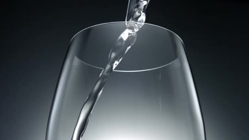 Clear Liquid being poured into a Glass