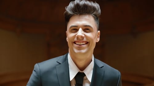 Portrait of Young Caucasian Man in Black Suit