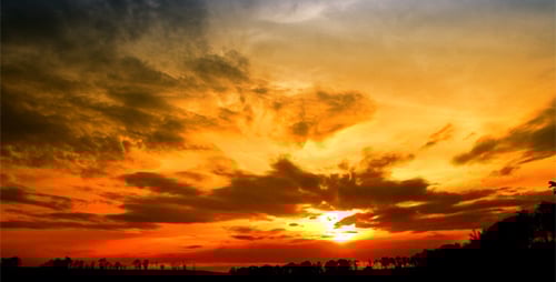 Vibrant Sunset Over a Dark Horizon