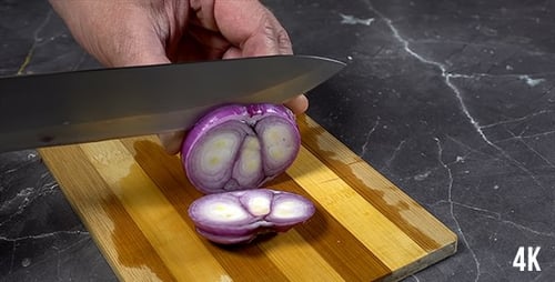 Cutting a Red Onion on Cutting Board