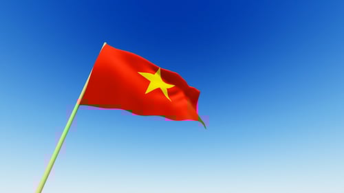 Waving Vietnam Flag with Blue Sky Background