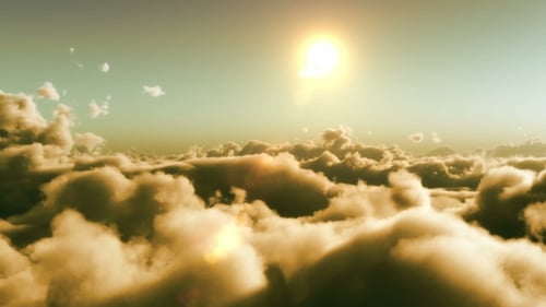 Flying Above Golden Clouds with Bright Sunset Sun