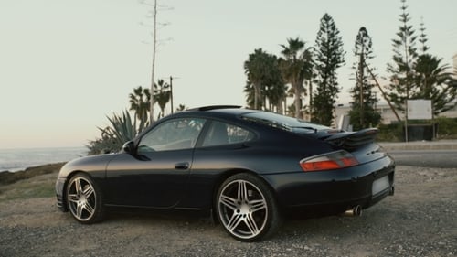 Black Sport Car on Trees Background